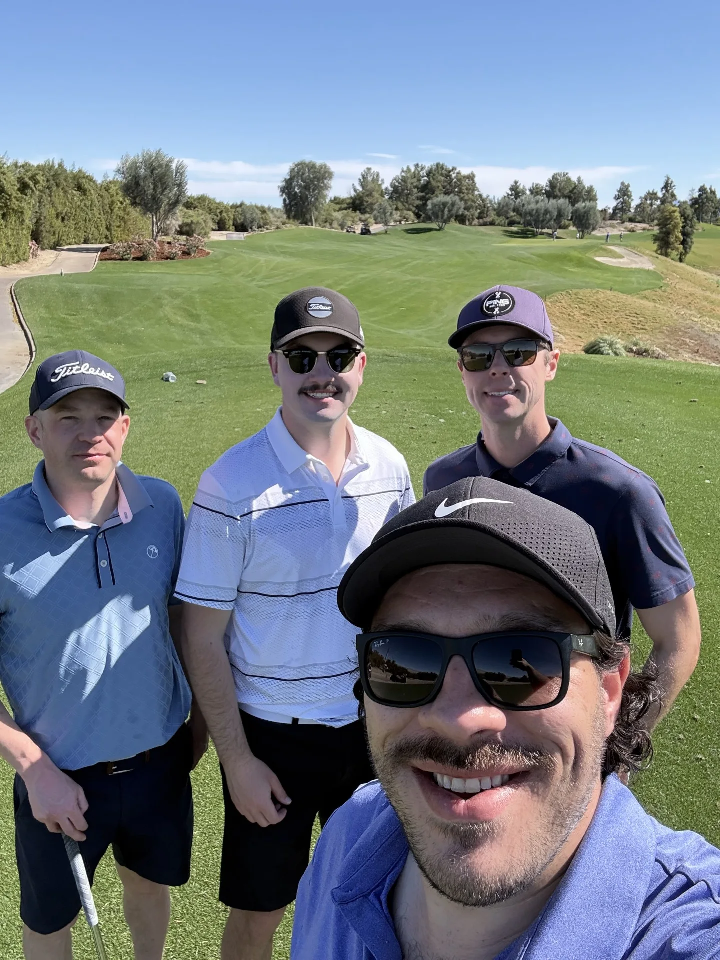 Plaid Jacket golfers taking a course selfie