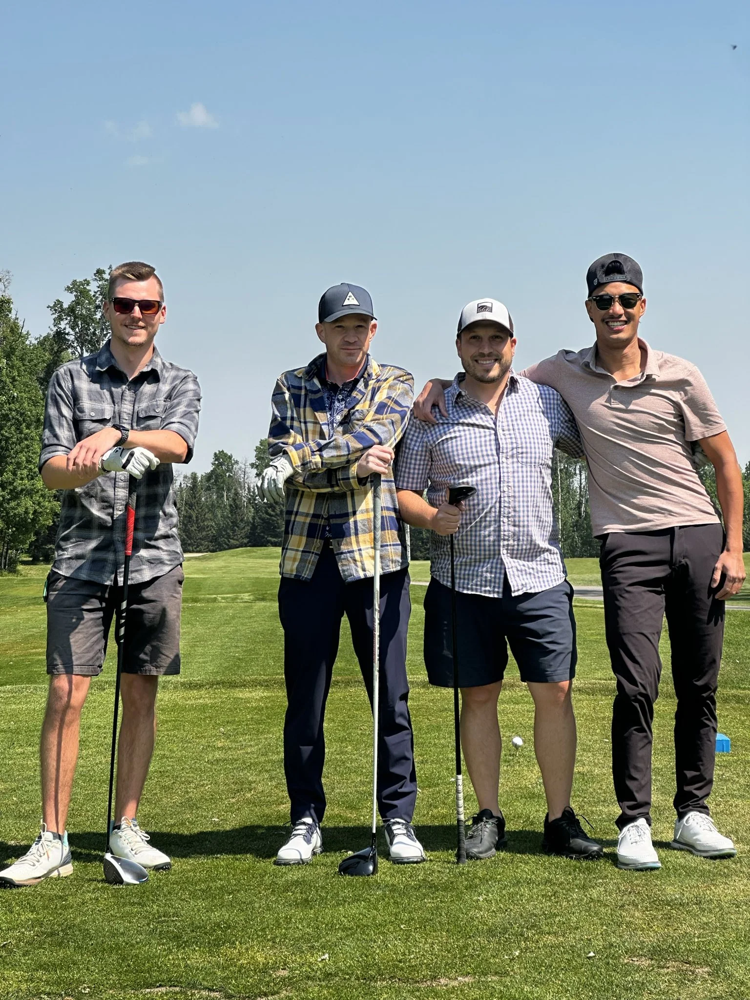 Plaid Jacket golfers together during a summer round